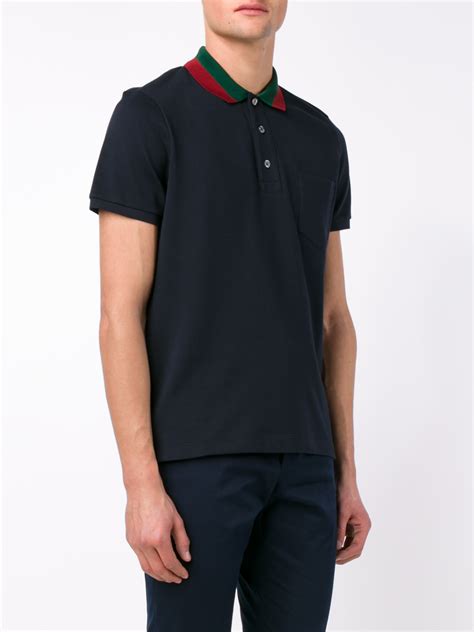 navy blue gucci polo shirt.